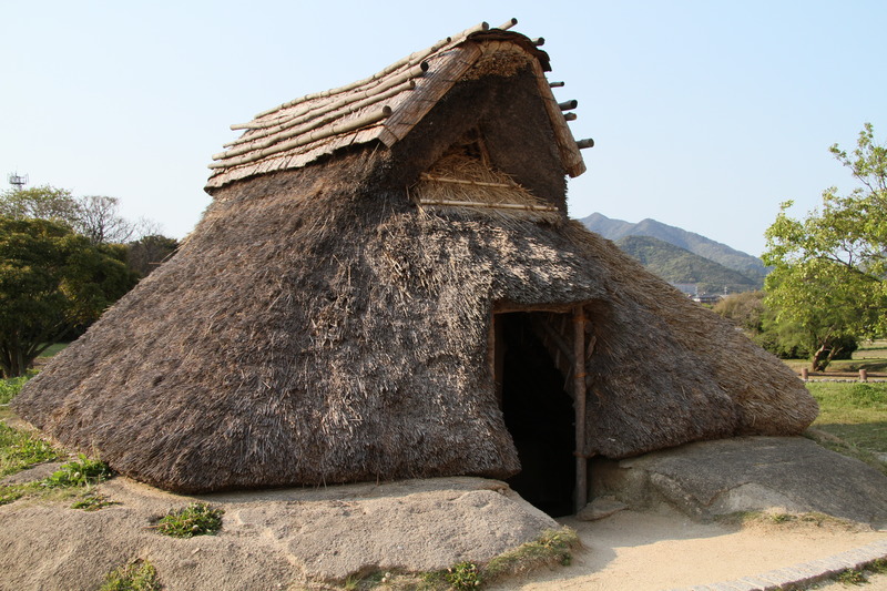 Pit dwelling with thatched roof